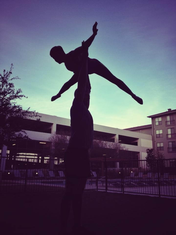 Steve doing acroyoga with his wife